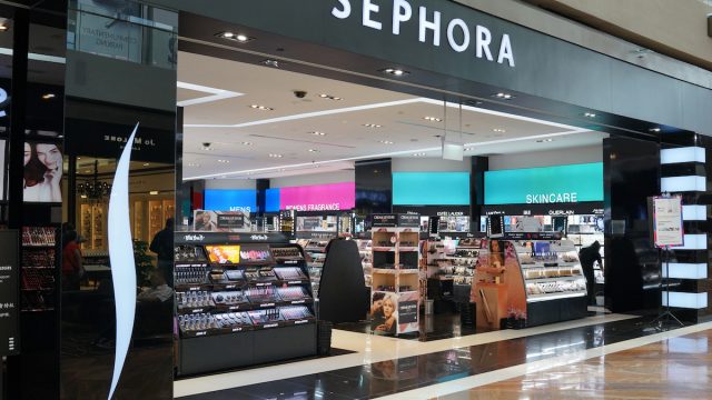 Wide view of the entrance to a Sephora store in a mall.