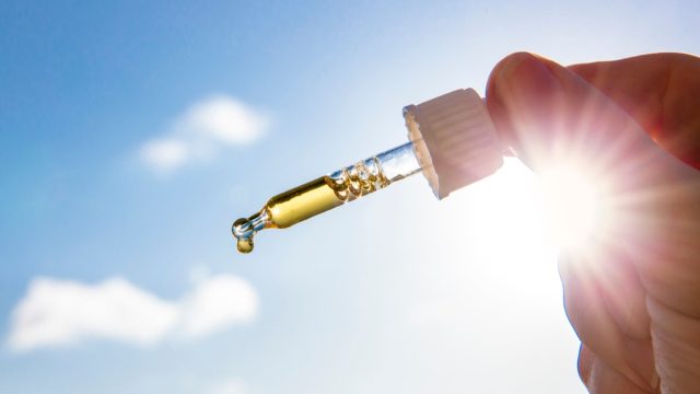 vitamin d dropper pipette in sunlight