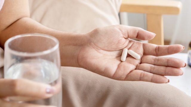 woman taking probiotics