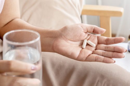 woman taking probiotics