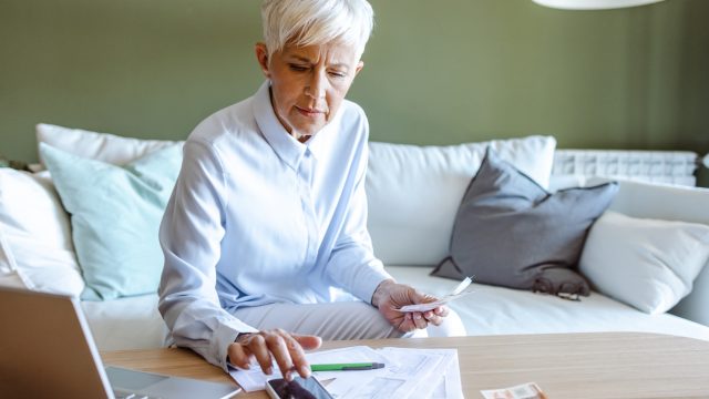A senior woman preparing her tax filing