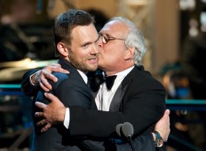 chevy chase kissing joel mchale on the cheek at the comedy awards