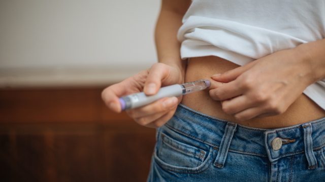 Woman doing insulin injection