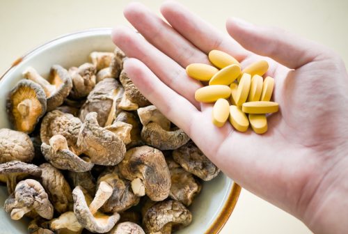 Mushroom with Vitamin pill. shot with swallow depth of field and selective focus