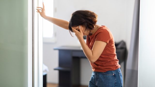Vertigo Concept. Young Woman Feeling Unwell At Home