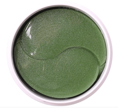 Top view of green eye masks on white background