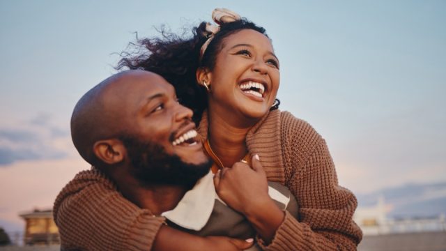 Happy couple having fun outside