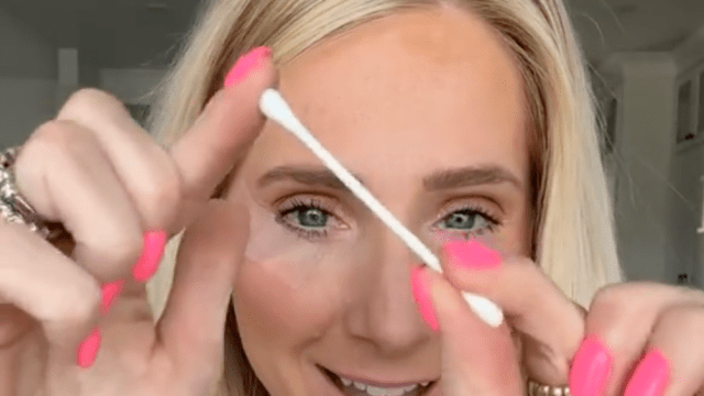 Makeup artist Lauren Hale posing with a Q-tip