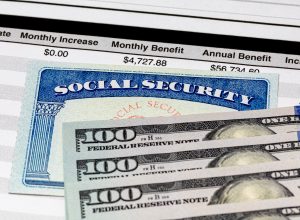 social security card and 100 dollar bills