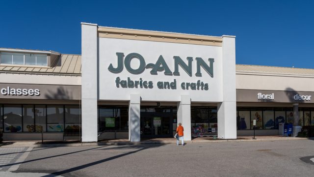 Sarasota, Florida, USA - January 11, 2022: A Woman walking into the JOANN Fabrics and Crafts store in Sarasota, Florida, USA. Jo-Ann is an American specialty retailer of crafts and fabrics.