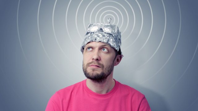 funny bearded man wearing am tin foil cap