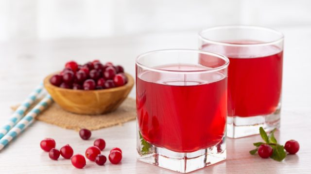 Glasses with cranberry juice and cranberries