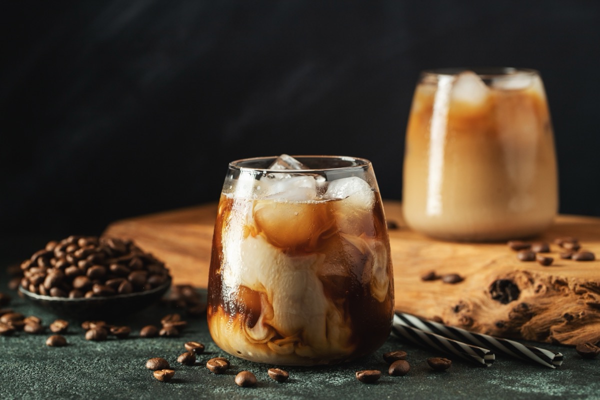 two glasses on iced espresso in glasses with milk