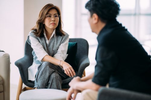 man and woman talking through divorce