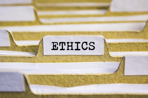 a label reading "ethics" on a file 