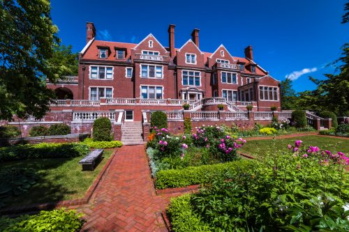 The famous Glensheen Mansion in Duluth, Minnesota and its summer garden display.