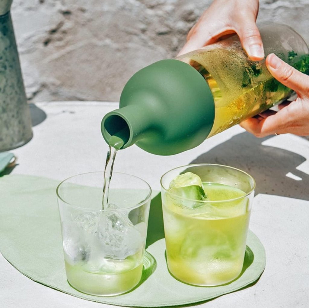 A Hario cold brew tea bottle pouring into two cups