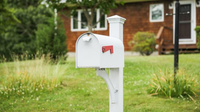mailbox on a front lawn
