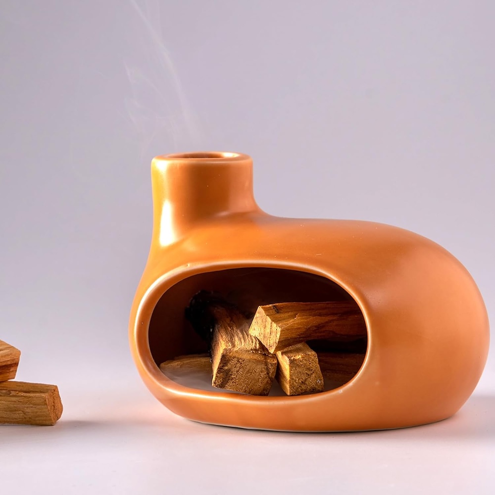A ceramic palo santo holder