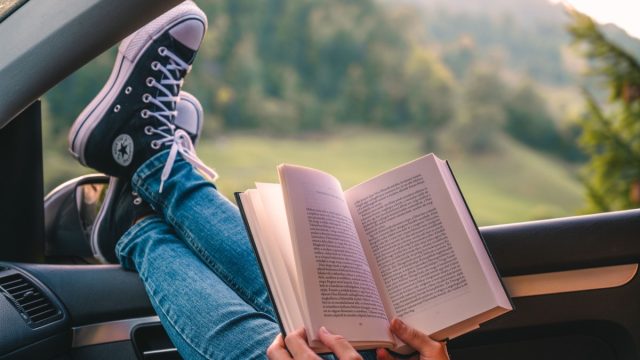 reading a book in the car