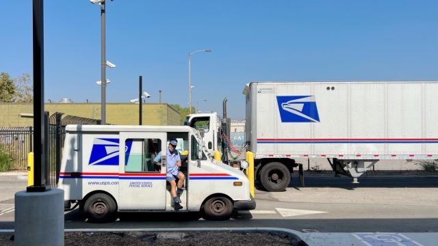USPS delivery truck departure from USPS Annex at Los Angeles Downtown.