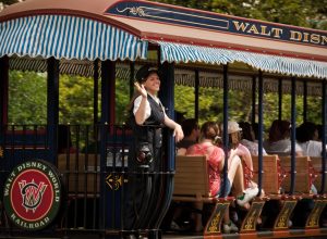 disney cast member waving from tram