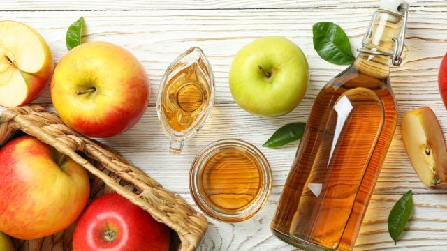 Homemade,Apple,Vinegar,And,Ingredients,On,White,Wooden,Table