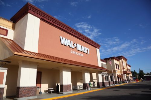 California Walmart storefront on a sunny spring afternoon. Walmart is an American public multinational corporation that runs chains of large discount department stores and warehouse stores.