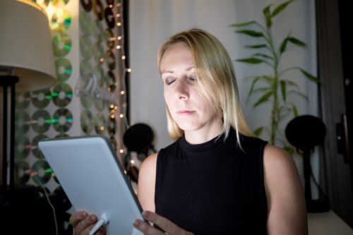 woman using light therapy lamp