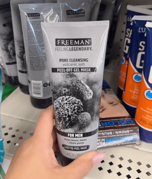 shopper holding facial mask at Dollar Tree
