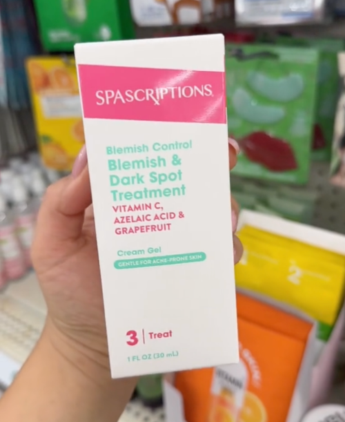 shopper holding skincare box at Dollar Tree