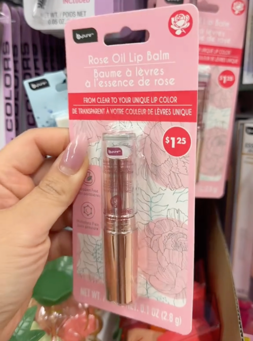 shopper holding lip gloss at Dollar Tree
