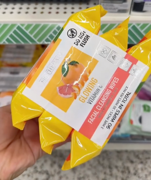 shopper holding facial wipes at Dollar Tree