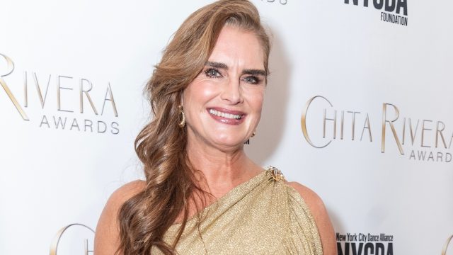 Brooke Shields in a gold dress