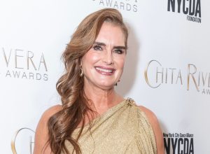 Brooke Shields in a gold dress