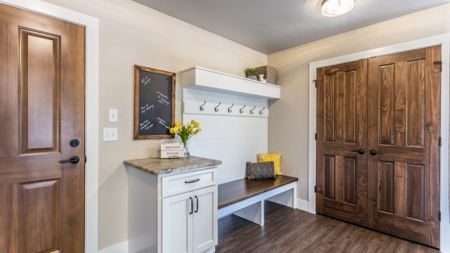 Mudroom with white and wood accents