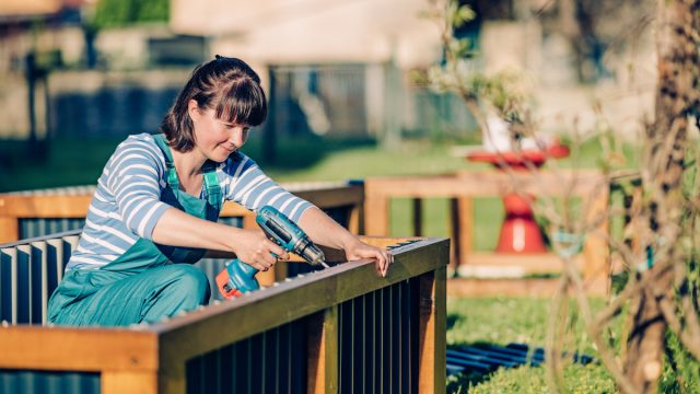 Woman building raised bed