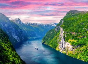 Panorama of breathtaking view of Sunnylvsfjorden fjord and famous Seven Sisters waterfalls, near Geiranger village in western Norway.