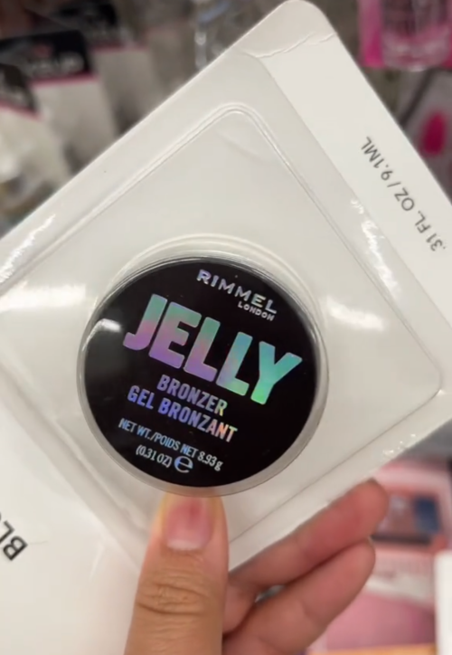 Dollar Tree shopper holding up Rimmel bronzer