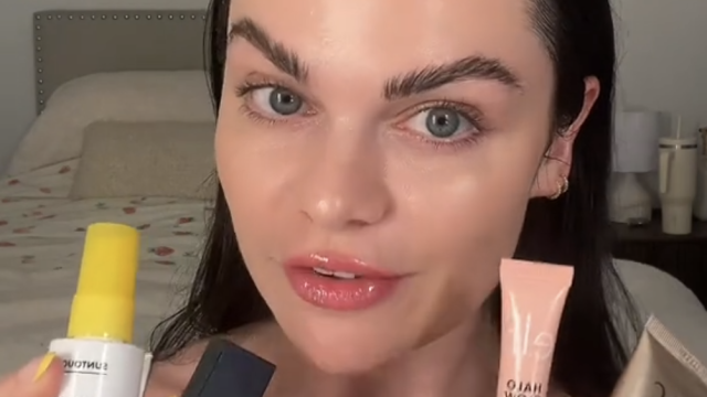 TikToker Kristyn Hoffman holding up makeup