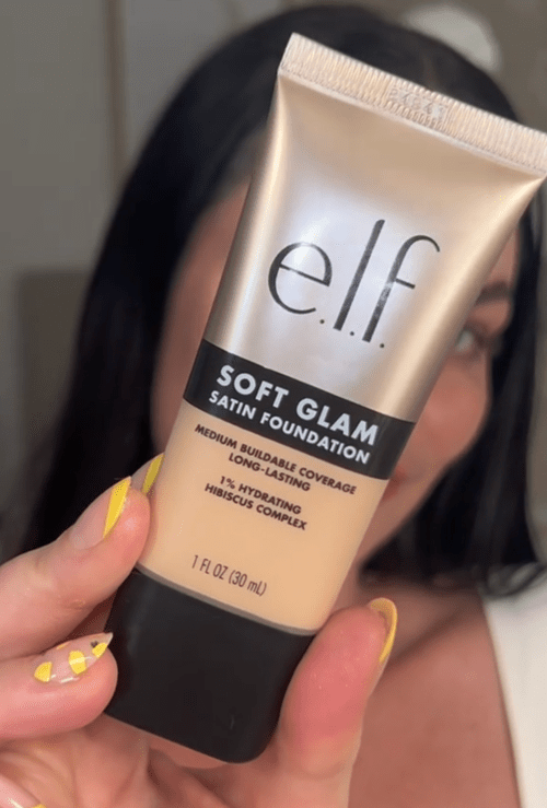 TikToker Kristyn Hoffman holding up makeup
