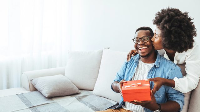 A couple exchanging a gift
