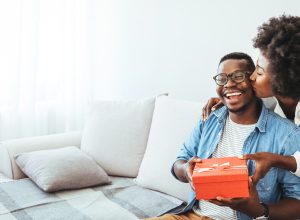 A couple exchanging a gift