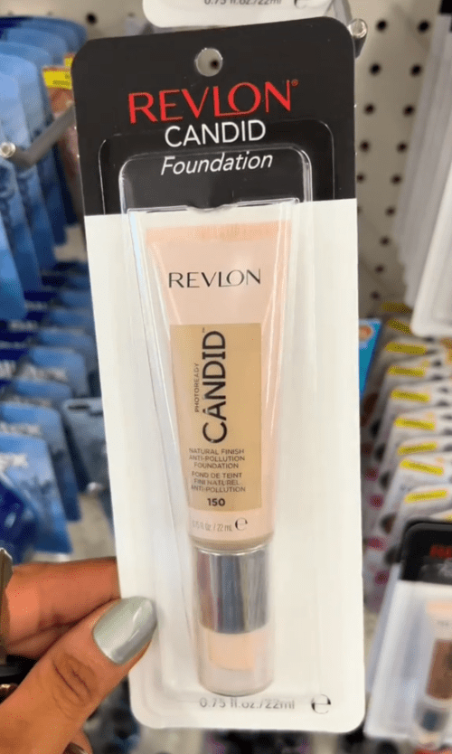 Dollar Tree shopper holding up a tube of Revlon foundation