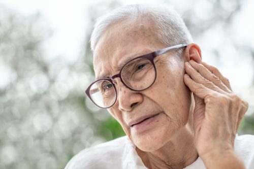 older woman with ear pain or swimmer's ear