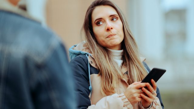 jealous woman making face at partner