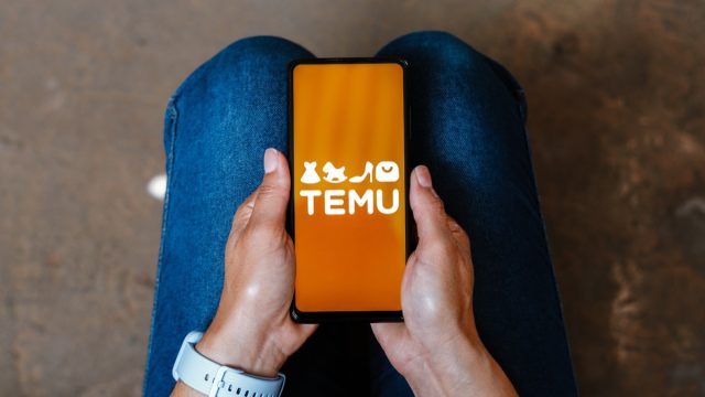 In this photo illustration, the Temu logo is displayed on a smartphone screen