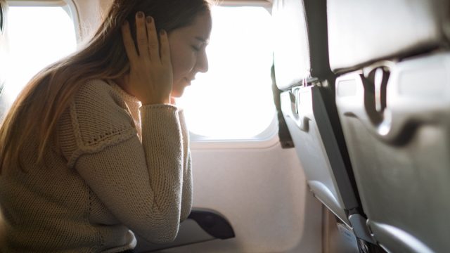 Young woman traveling with airplane