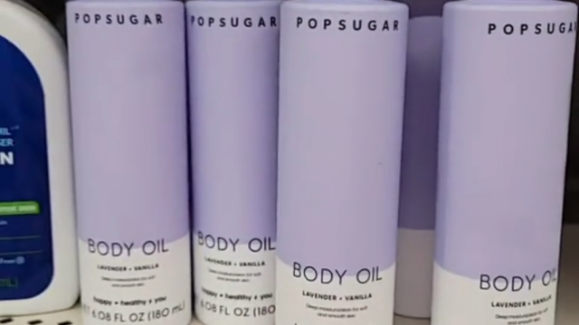 purple bottles of Popsugar body oil on display at Dollar Tree