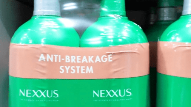 Closeup of Nexxus shampoo and conditioner in green bottles at Costco